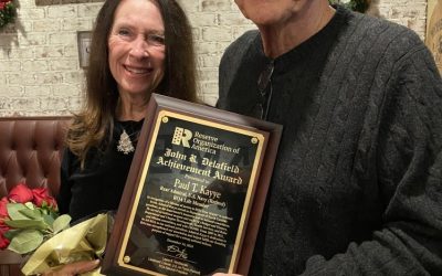 Rear Adm. Paul T. Kayye recognized during Christmas luncheon